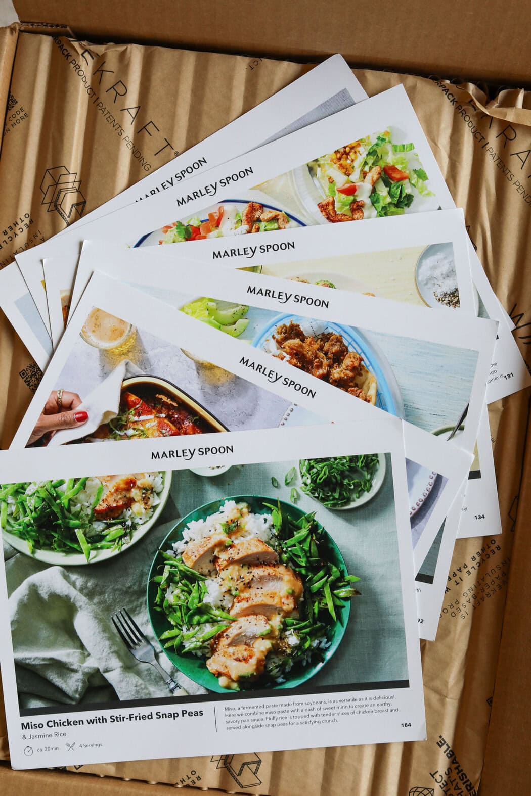 Sheets showing the variety of recipes and directions for Marley Spoon delivery meals 