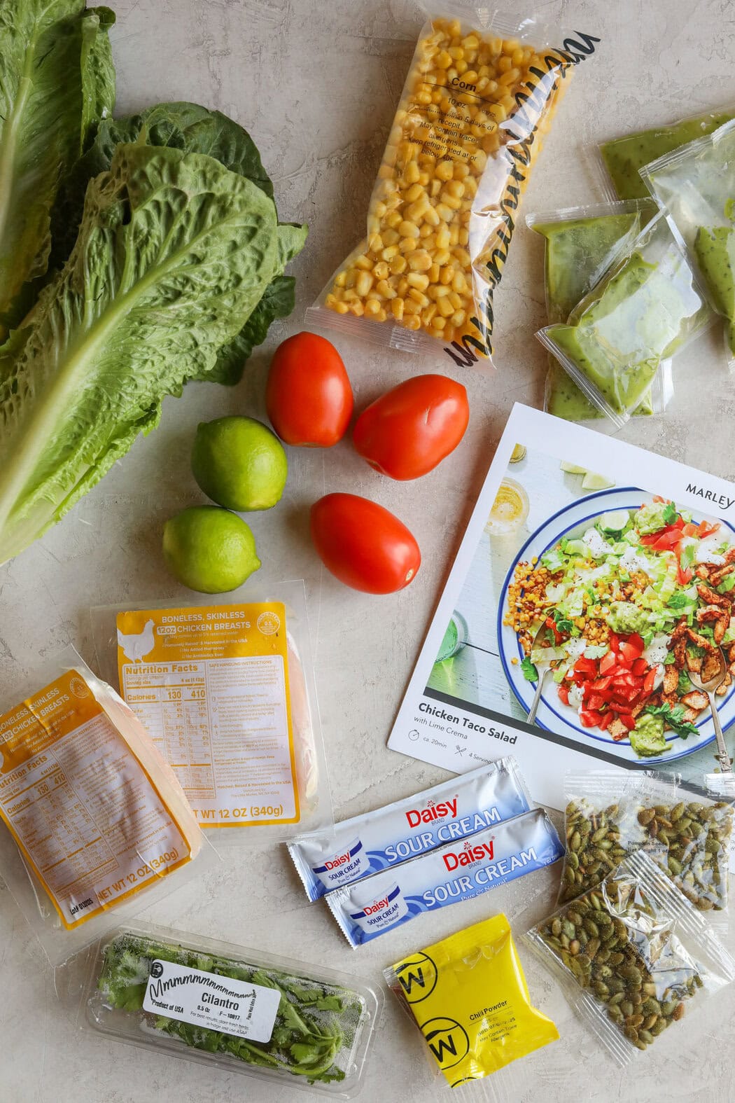 Overhead view of a variety of ingredients for a Marley Spoon home delivery kit. 