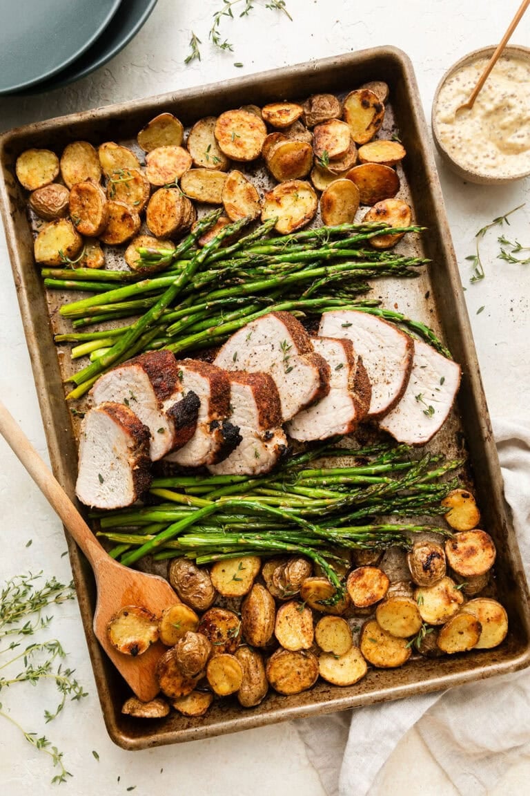Sheet Pan Pork Tenderloin with roasted potatoes and asparagus.