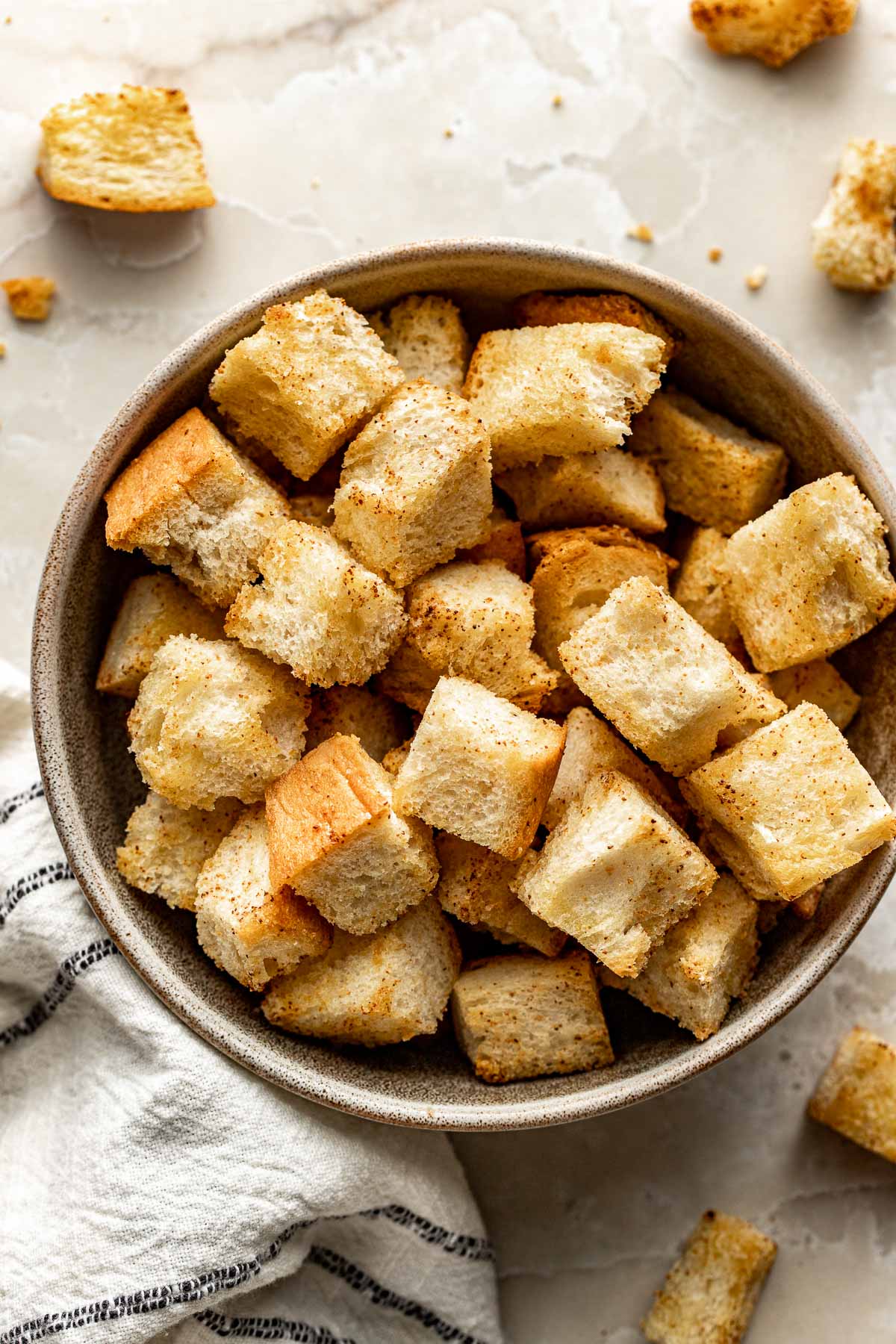 Overhead view of a full bowl of Homemade Croutons perfectly toasted