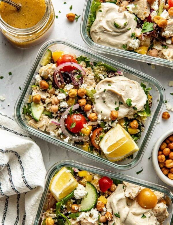 Close up overhead view Mediterranean chopped salad in glass meal prep containers