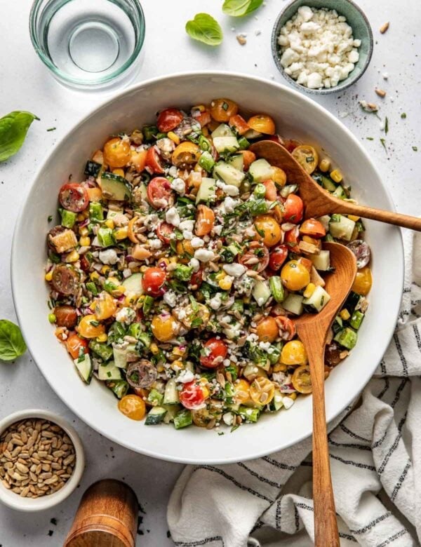 Overhead view white bowl filled with summer salad of fresh produce
