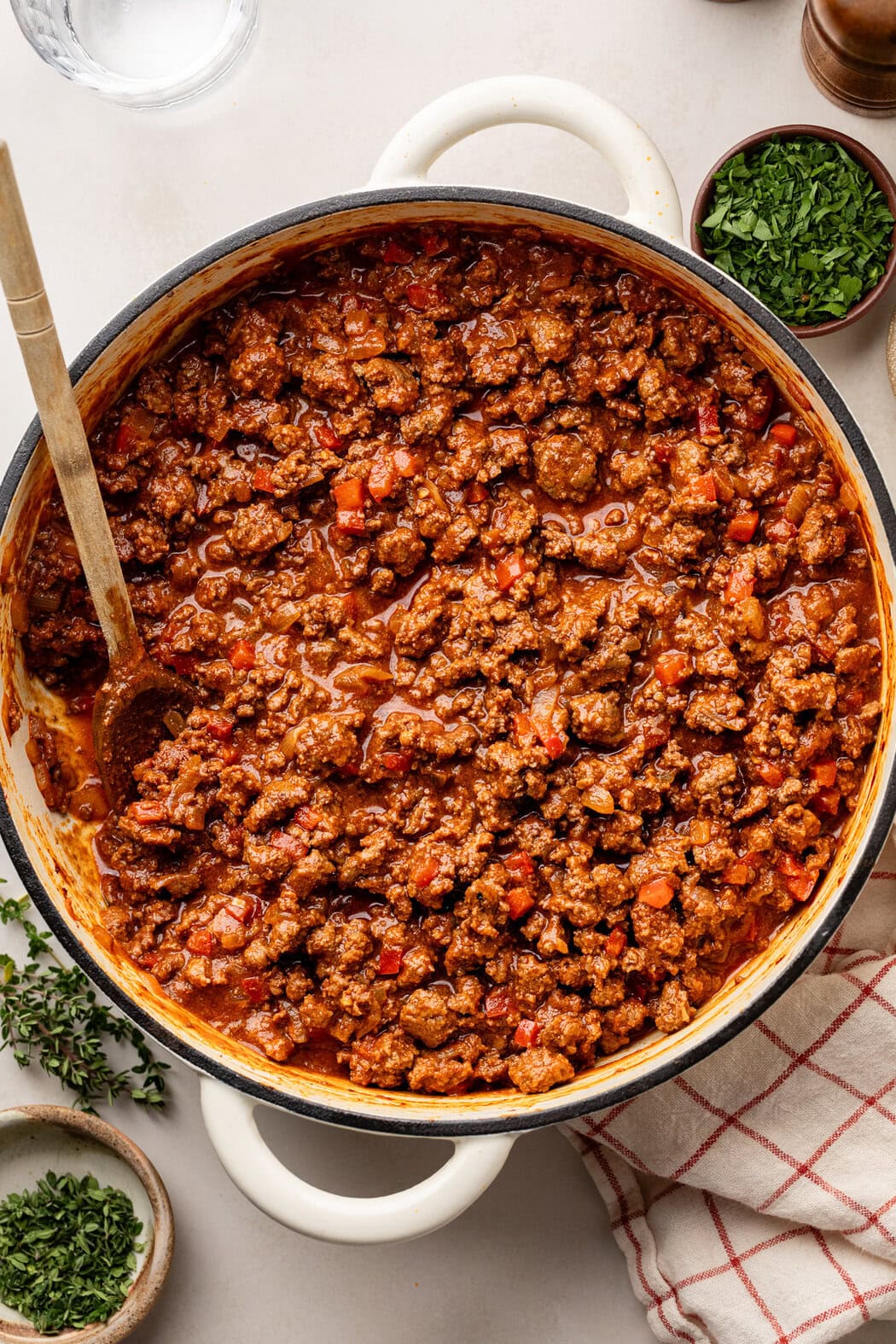 Overhead view of a skillet filled with sloppy joe meat mixture. 