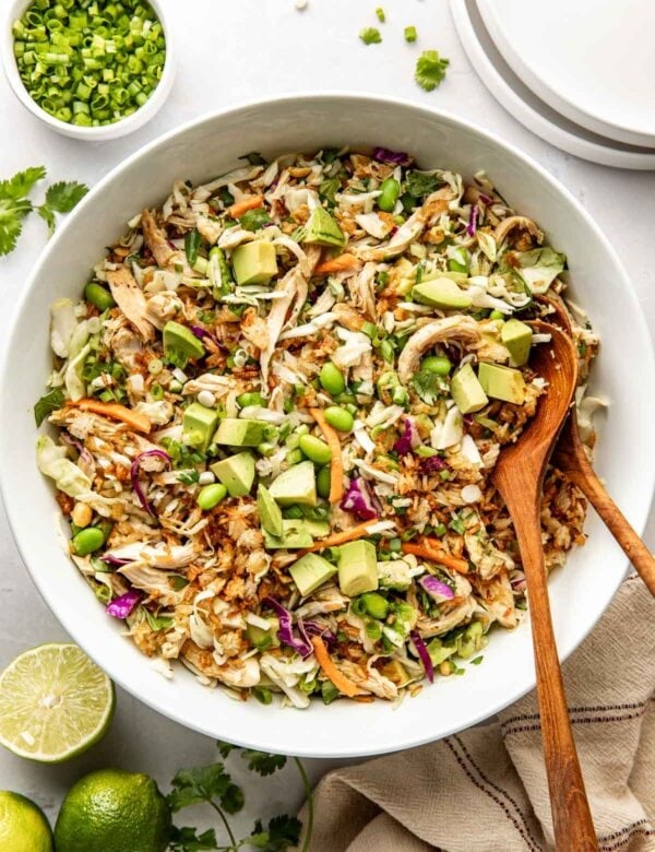 Overhead view crispy rice salad with diced avocado in a serving bowl