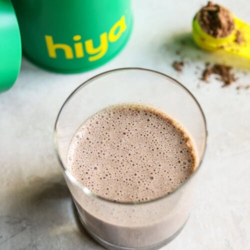 Overhead view of a cup of hiya drink mix showing the chocolate frothy top.