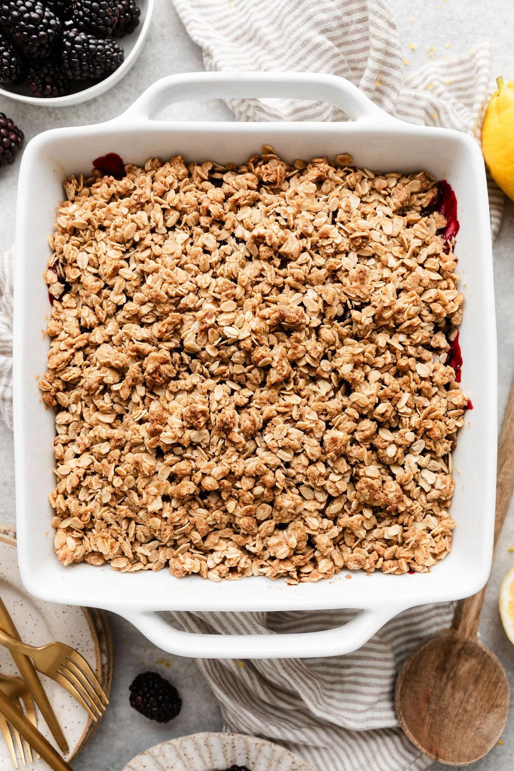 Overhead view of a freshly baked dish of Blackberry Crumble with a crisp oat topping.