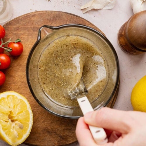 Overhead view of a bowl of Italian Dressing.