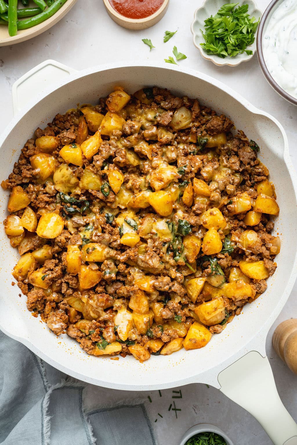 A cheesy ground beef and potatoes skillet.