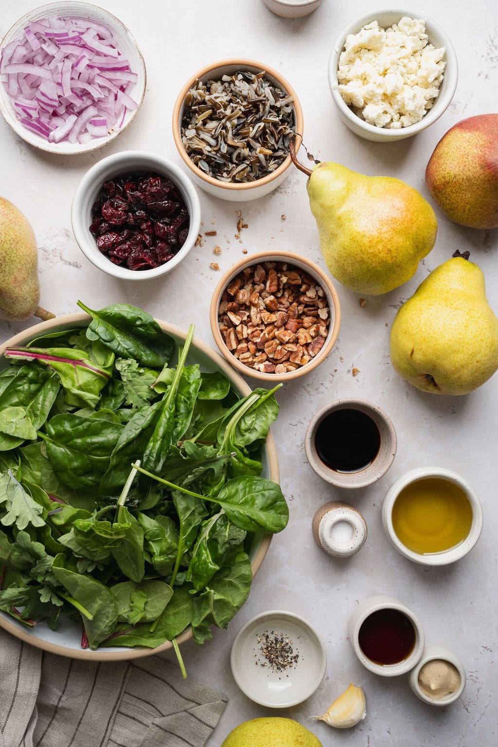 Ingredients to make pear salad with balsamic vinaigrette.