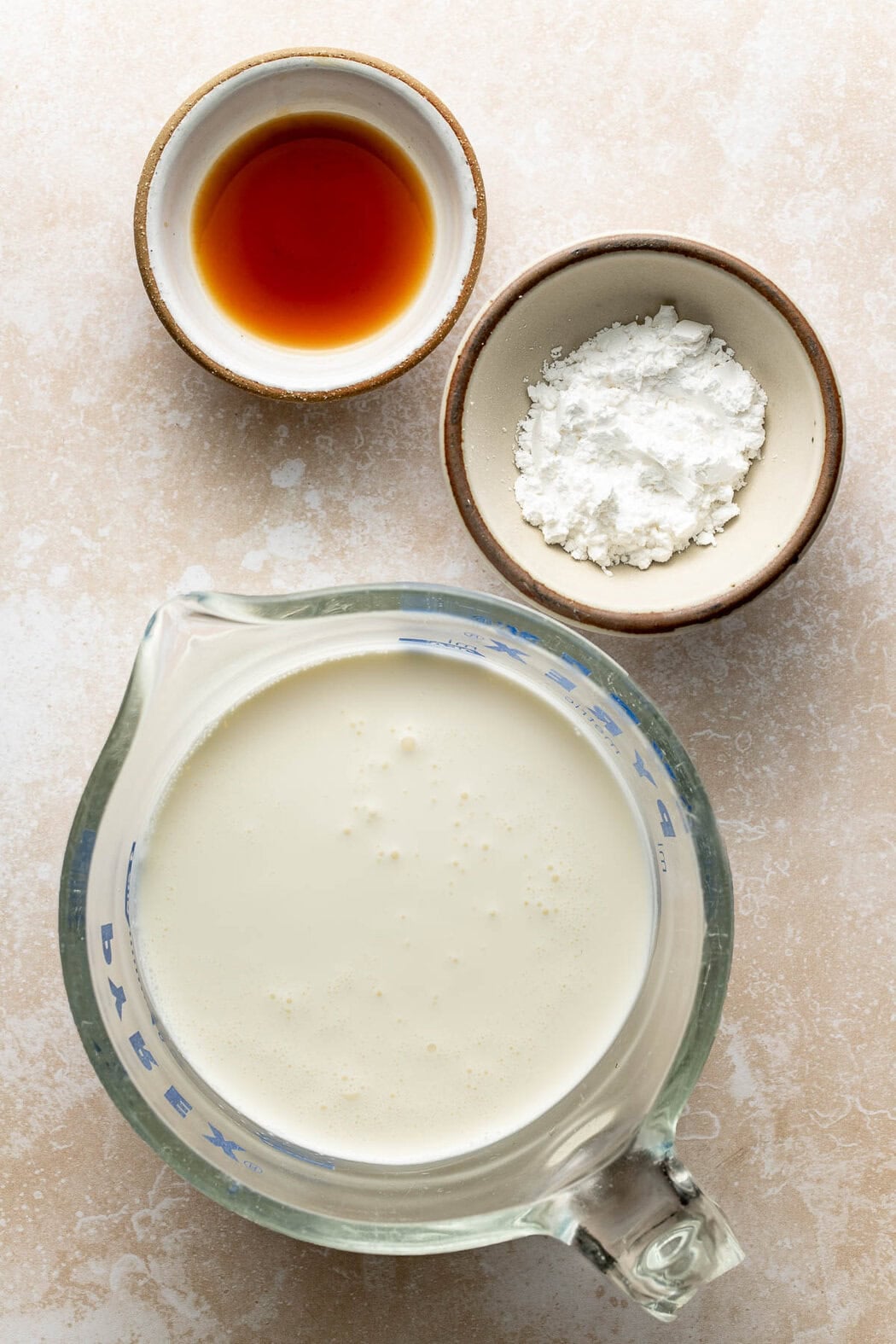 Cream, powdered sugar, and maple syrup to make homemade whipped cream.